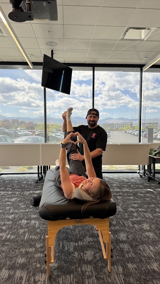 Corporate client stretching with a mountain view